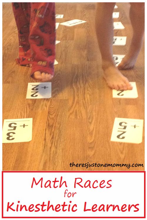 two children standing on the floor with numbers in front of them and one child's feet