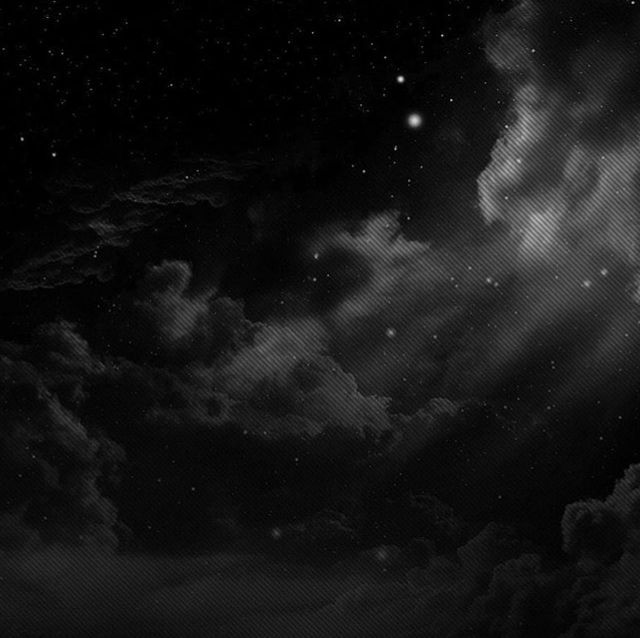 black and white photograph of the night sky with stars in the clouds, moon behind