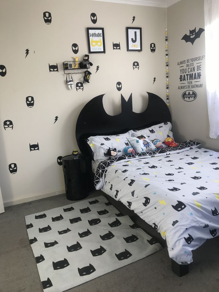 a batman themed bedroom with black and white decor