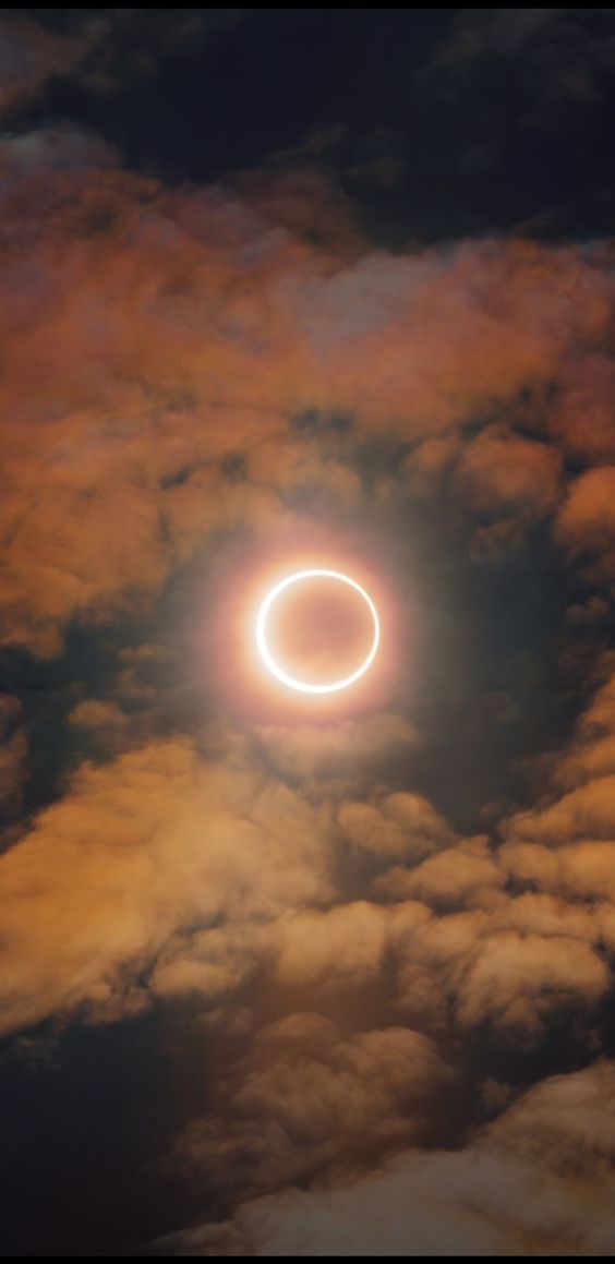 the solar eclipse is seen through clouds in this image