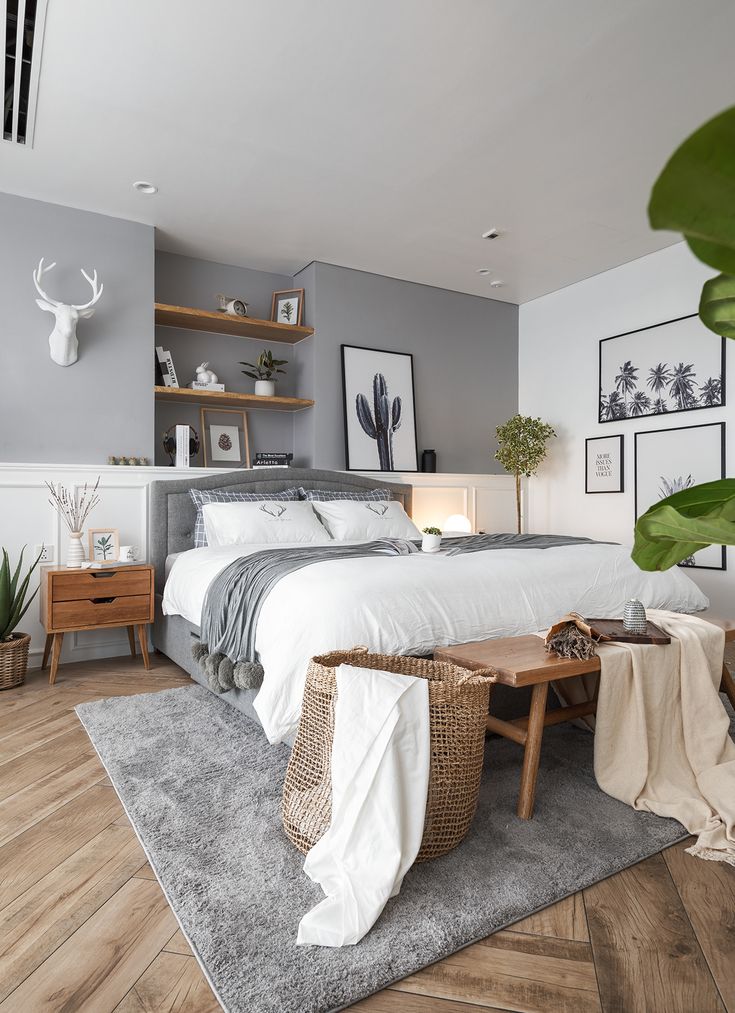 a bed sitting in a bedroom next to a wooden table