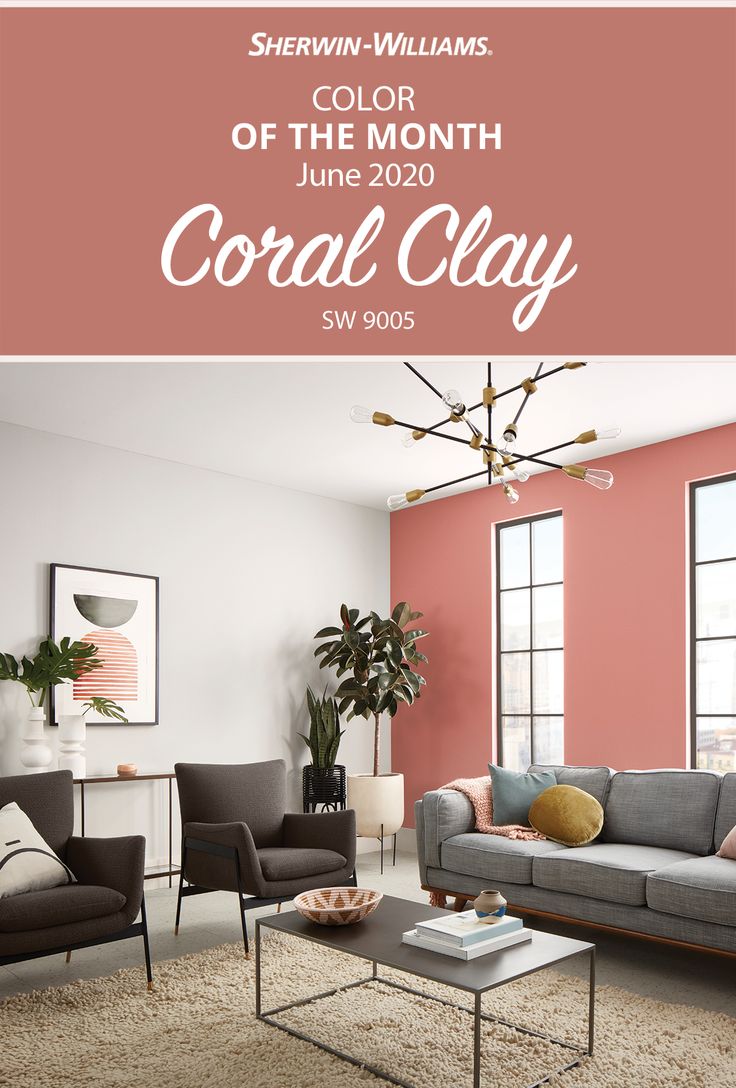 a living room with pink walls and gray furniture in the center is an advertisement for coral clay