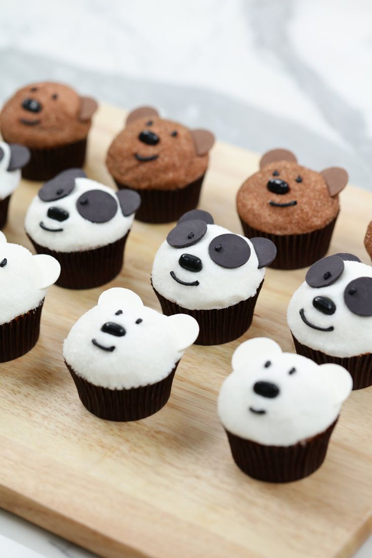 there are many cupcakes that have been decorated with different animals on top of them