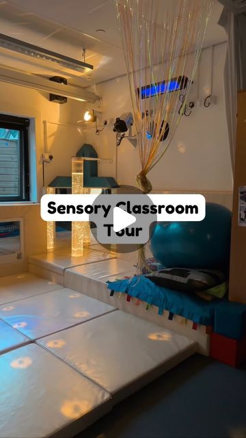 an empty classroom with blue chairs and white tiles on the floor that says sensory classroom tour