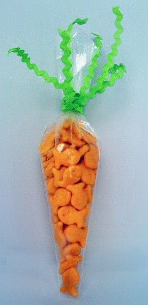 a plastic bag filled with carrots sitting on top of a table