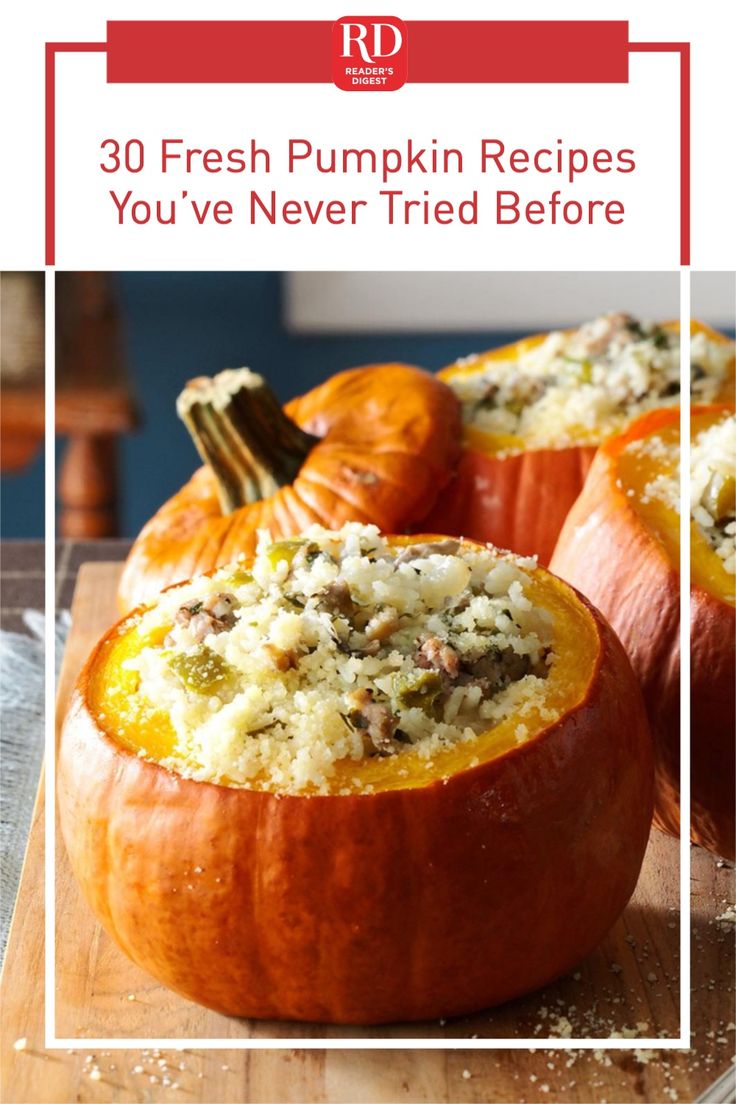 three stuffed pumpkins sitting on top of a cutting board with the words sausage and rice stuffed in them