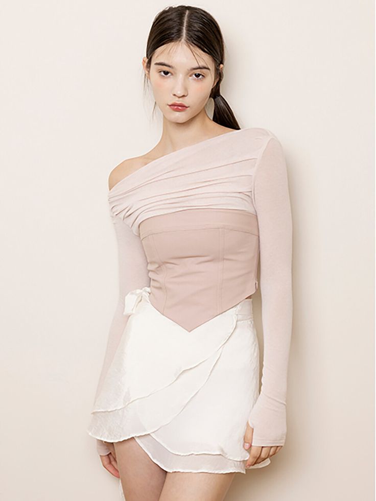 Editor's Notes The bustier top is made from tight spandex material for a tight fitting bodice and has a loosely draped top. - Triangle bottom hem- Thumbhole on sleeves- Tight fitting bodice and sleeves- Soft, flowy fabricMeasurements(in.)S / M- Length: 16.92 in. / 17.51 in.- Chest: 15.35 in. / 16.33 in.- Shoulder: 14.56 in. / 14.96 in.- Sleeve: 24.40 in. / 24.80 in.Model info: Sofia - Height 5' 8'', Fitting Size SComposition & Care- 75% Cotton, 21% Nylon, 4% Spandex- Dry cleaning onlyDesigner- by NOT YOUR ROSE Feminine Off-shoulder Fitted Tube Top, Feminine Fitted Off-shoulder Tube Top, Fitted Feminine Off-shoulder Tube Top, Stretch Boned Bodice Crop Top, Feminine Fitted Asymmetrical Top, Fitted Asymmetrical Feminine Top, Fitted Feminine Asymmetrical Top, Feminine Fitted Ruched Crop Top, Pink Fitted Top With Asymmetrical Neckline