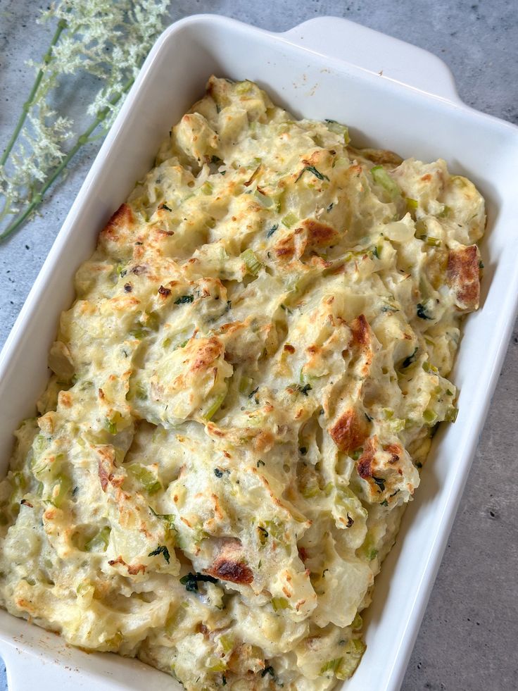 a casserole dish with broccoli and cheese