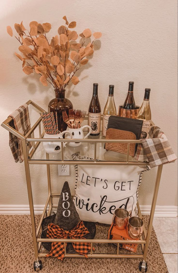 a bar cart filled with bottles and other items