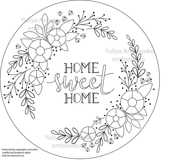 a round frame with the words home sweet home written in black and white on it