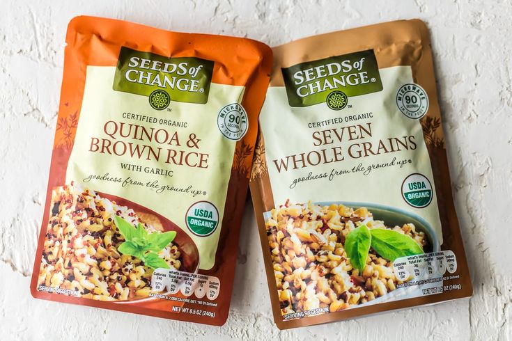 two bags of seedy change quinoa and brown rice on a white surface