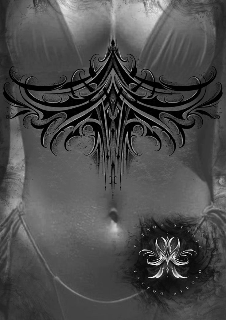 an artistic black and white photo of a woman's stomach with tattoos on it