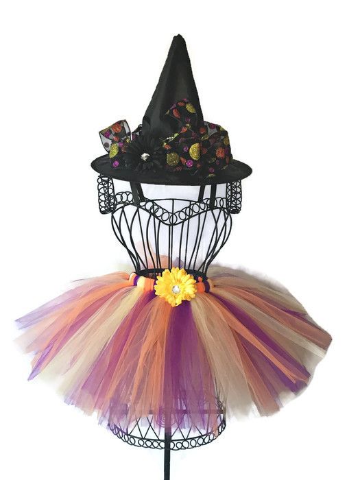 a black hat with orange and purple tulle