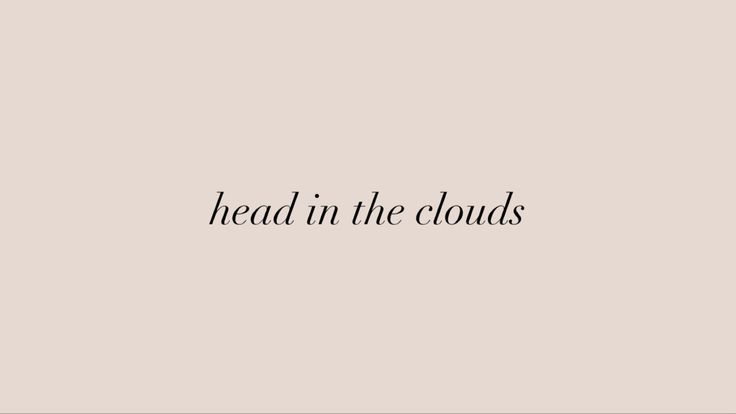 the words head in the clouds written on a beige background with black text below it