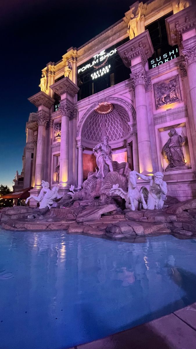 the las vegas hotel and casino is lit up at night