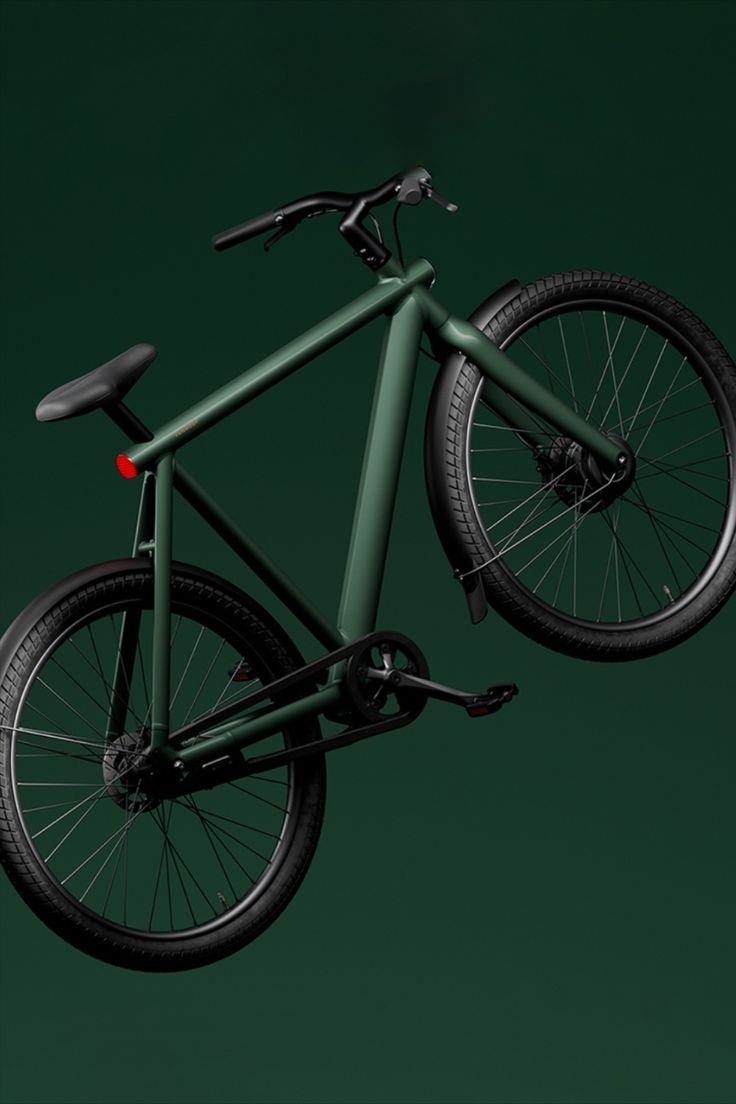 a green bike with black spokes is flying through the air in front of a dark background