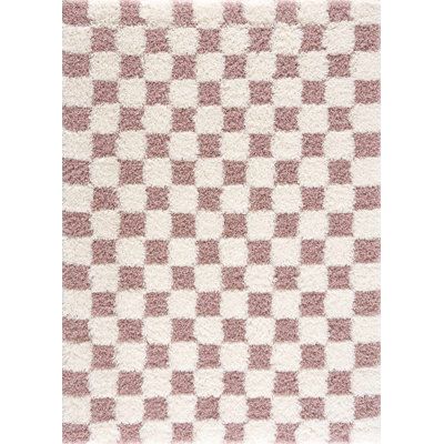 a pink and white checkerboard rug