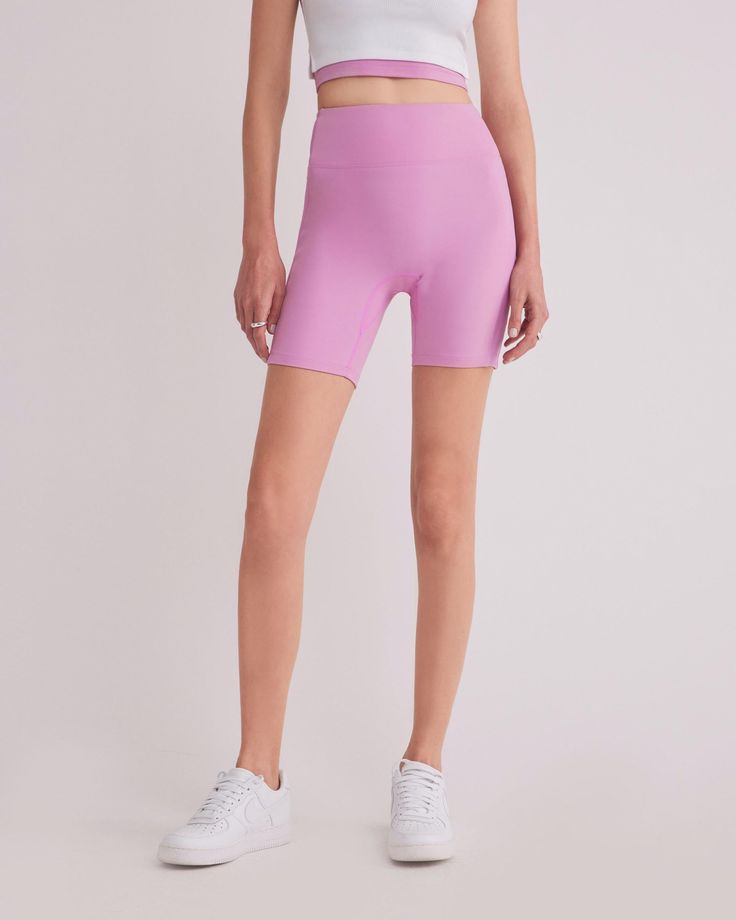 DETAILS: Color: Bubble gum pink High waist biker shorts with side contrast fabric Super soft & delicate brushed body fabric Medium weight 2x2 ribbed fabric on side panel Rubberized brand logo detail at back waist Body: 77% Nylon, 23% Spandex Contrast fabric: 93% Polyester, 7% Spandex Machine wash SIZE & FIT: Fits true to size Waist: 10 3/4" Inseam: 7" Model is wearing a size S Compressive Spring Activewear Shorts, Spring Sports Compressive Shorts, Stretch Athletic Shorts With Ribbed Waistband, Sporty High Stretch Solid Color Shorts, Compressive Activewear Shorts For Spring, Spring Compressive Activewear Shorts, Trendy High Stretch Biker Shorts, High Stretch Short Length Trendy Biker Shorts, High Stretch Biker Shorts For Spring