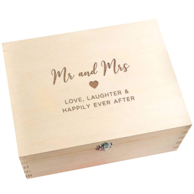 a wooden box with the words mr and mrs engraved on it's lid, in front of a white background