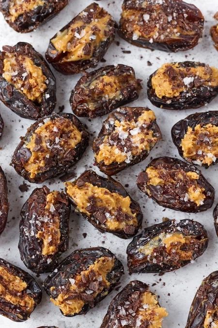 baked eggplant stuffed with cheese on a white plate and sprinkled with powdered sugar