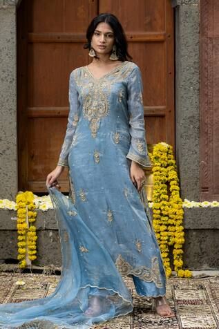 Blue kurta with thread embroidered floral vine motifs, embellished by beads, cutwork and scalloped border. Comes with palazzo and scallop border dupatta. - Aza Fashions Festive V-neck Kurta With Intricate Embroidery, Unstitched Blue Tissue Silk Kurta, Wedding Kurta With Resham Embroidery And V-neck, Wedding V-neck Kurta With Resham Embroidery, Blue V-neck Sets With Resham Embroidery, Blue Raw Silk Kurta With Sheer Dupatta, Blue Kurta With Sheer Dupatta In Raw Silk, Blue Unstitched Suit With Chikankari Embroidery For Reception, Blue Chikankari Embroidery Unstitched Suit For Reception