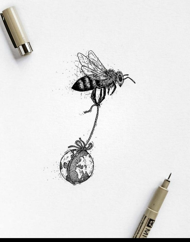 a pencil drawing of a bee on top of a piece of paper