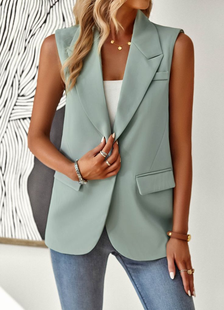 Introducing the Radford Blazer Vest - Sage. A versatile, stylish addition to any wardrobe. Combining the classic blazer silhouette with the comfort and convenience of a vest, this piece is perfect for any occasion. Dress it up or down, and stay on-trend with this must-have garment. Size Guide: Model is 5’8” tall, and has a 33.5” bust, 26.5” waist, & 36.2” hips. She is wearing a S / US 4 / AU 8. This vest is true to size. Material: Self: 90% Polyester 10% Spandex, Lining: 100% Polyester. Feature: Pocketed. Notched lapel. Sleeveless. Front button closure. Relaxed oversized fit. Care Instructions: Machine wash / Cold hand wash Elegant Blazer With Vest And Lapel Collar, Chic Formal Vest With Lapel Collar, Spring Semi-formal Single Breasted Vest, Fall Business Casual Blazer, Chic Single-breasted Vest With Lapel Collar, Casual Workwear Vest With Lapel Collar, Elegant Business Casual Blazer With Vest, Elegant Blazer With Vest For Business Casual, Formal Single-breasted Vest For Spring