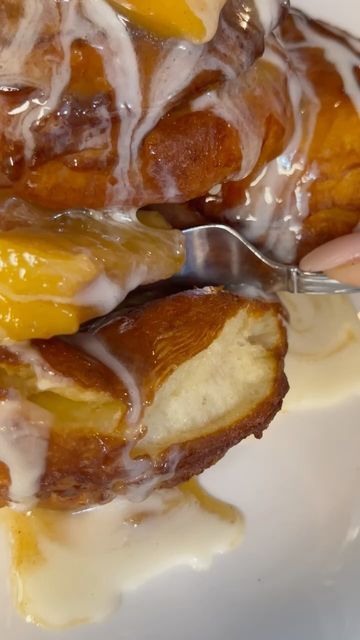 a white plate topped with donuts covered in frosting