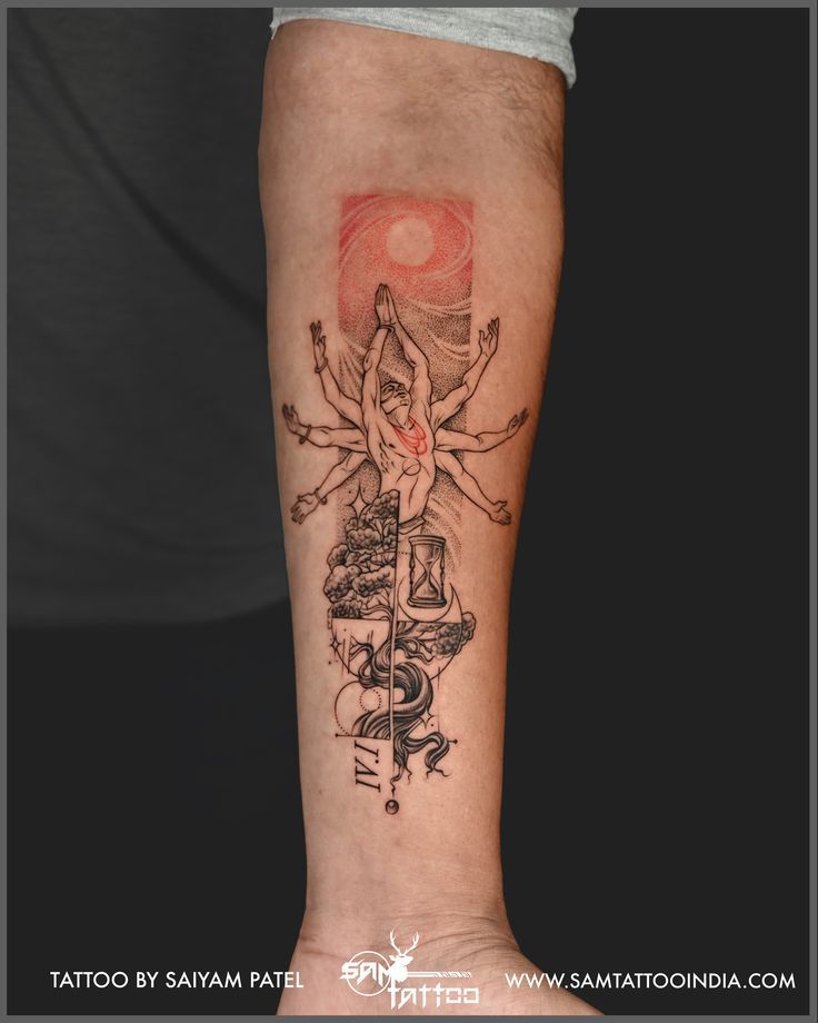 a person with a tattoo on their arm and leg, holding a cross in one hand