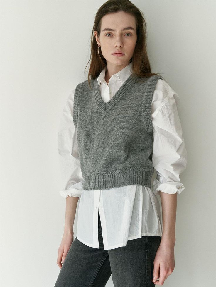 Short, soft, knit sweater vest in 100% superfine Merino wool. V-neck and ribbing at neckline, armholes, and hem.- Short- V-neck- Sleeveless Womens Grey Sweater, Knit Sweater Vest, Knitwear Women, V Neck Sweater, Sweater Vest, Grey Sweater, Vneck Sweater, Knit Sweater, Merino Wool