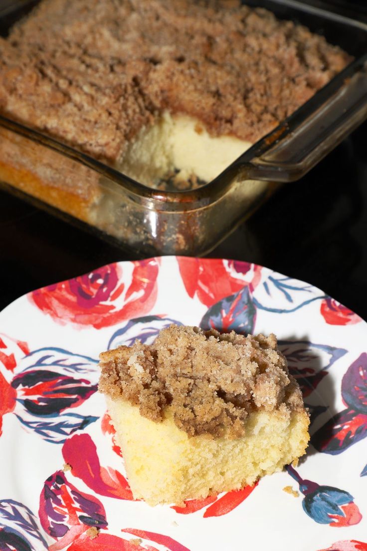 a piece of cake sitting on top of a plate next to a pan of food