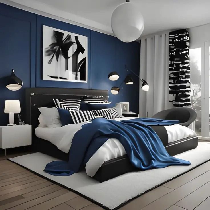 a bed room with a neatly made bed and blue walls