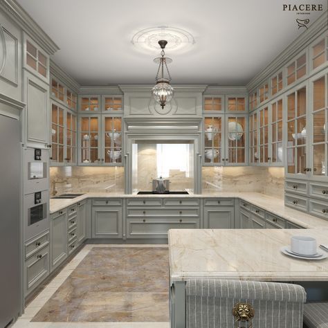 a large kitchen with gray cabinets and marble counter tops