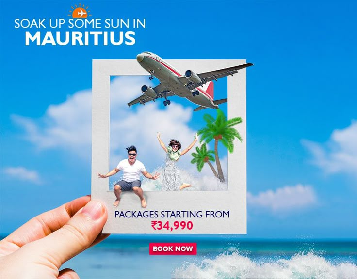 a person holding up a card with an image of two people on the beach in front of an airplane