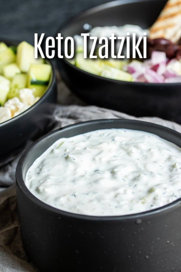 two black bowls filled with white sauce and cucumber salad next to each other