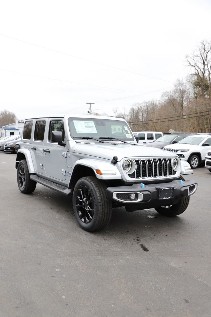 a white jeep parked in a parking lot