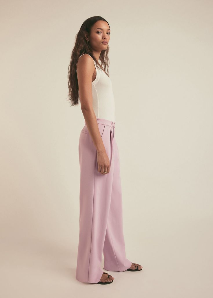 The Low Favorite Pant is our best-selling mid-rise trouser (formerly The Agnes Pant), cast in a smooth, satiny fabric. With a fluid wide-leg silhouette and front pleats, these Pastel Lavender pants look gorgeous on their own and look extra chic when paired with The Smooth Ex-Boyfriend Shirt. 74% Polyester, 22% Rayon, 4% Elastane Suiting Blend Lameka is 5'9.5" wearing a size 2Rise: 11 1/2"Leg Opening: 21"Inseam: 34" Video: Misia is 5' 10" wearing a size 14 Lauren is 5’10” a size 6 Feminine Wide Leg Bottoms For Daywear, Feminine Bottoms For Daywear, Feminine Wide Leg Pants For Loungewear, Elegant Wide-leg Purple Pants, Lavender Wide Leg Bottoms For Summer, Lavender Straight Leg Bottoms, Lavender Wide-leg Bottoms For Summer, Lavender Pants For Spring Loungewear, Spring Lavender Loungewear Pants