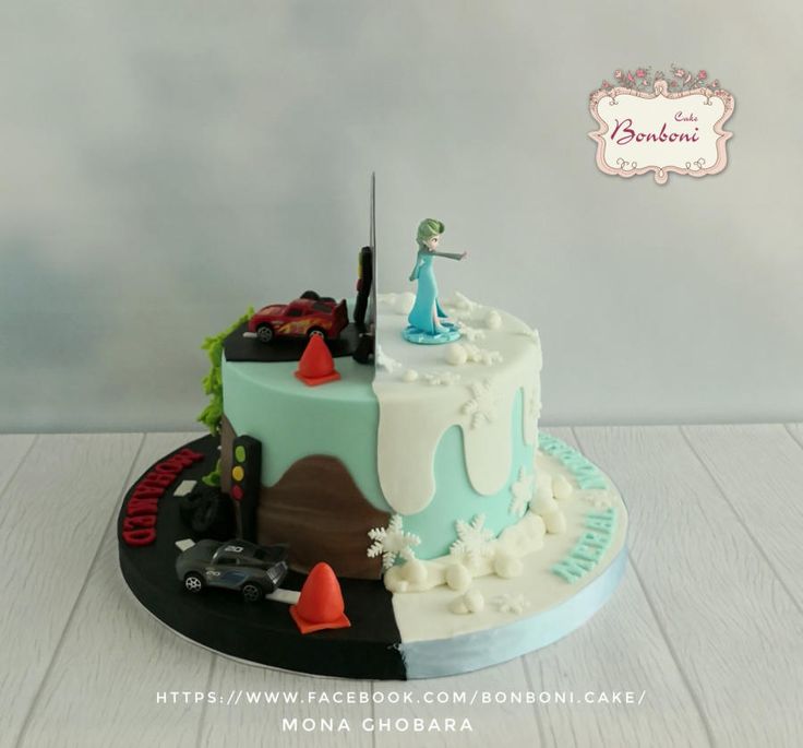 a birthday cake with cars and people on the top is decorated in pastel colors