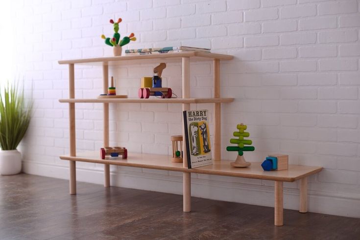 Open Wood Shelves for the Montessori Home or Classroom -- Here seen with an array of toys on the first two levels with multicolored organizing bins up top. Shelf Minimalist, Learning Materials, Classroom Furniture, Modular Shelving, Living Table, Bottom Shelf, Wooden Shelves, Quality Furniture, Girls Bedroom