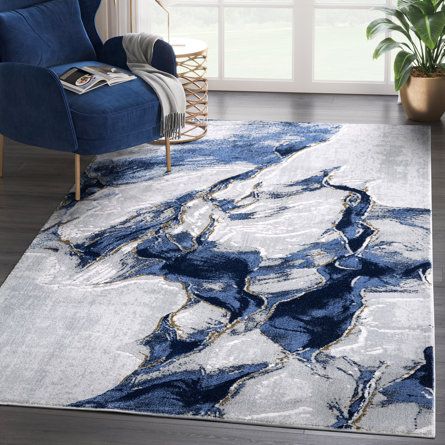 a blue and white rug in a living room