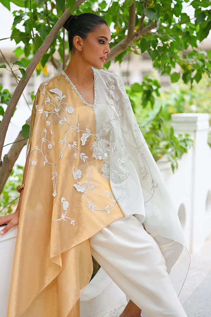 Rida Wedding Palazzo Set With Embroidered Sleeves For Eid, Traditional Silk Palazzo Set With Cape Sleeves, Silk Kaftan With Dupatta For Wedding, Elegant Embroidered Kurta With Cape Sleeves, Embroidered Blouse Piece With Cape Sleeves For Wedding, Festive Sheer Dupatta Kaftan With Cape Sleeves, Festive Kaftan With Sheer Dupatta And Cape Sleeves, Anarkali Kurta With Cape Sleeves, Designer Embroidered Kurta With Cape Sleeves