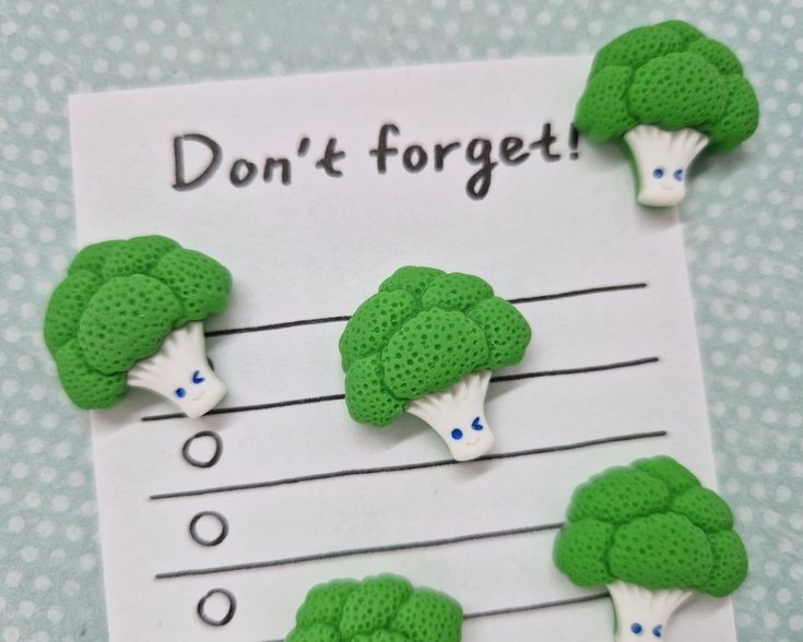 broccoli magnets on a piece of paper that says don't forget