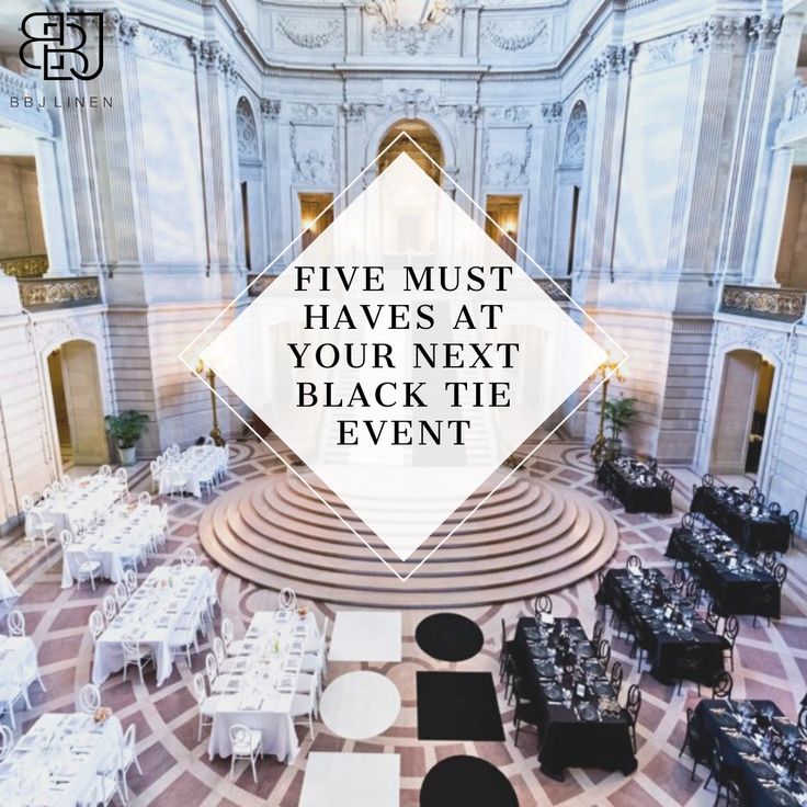 the inside of a building with tables and chairs set up for a black tie event