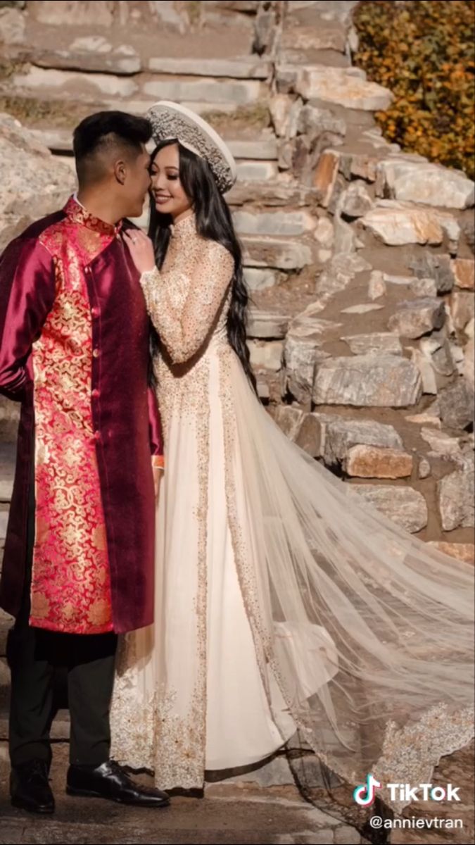 a bride and groom standing next to each other