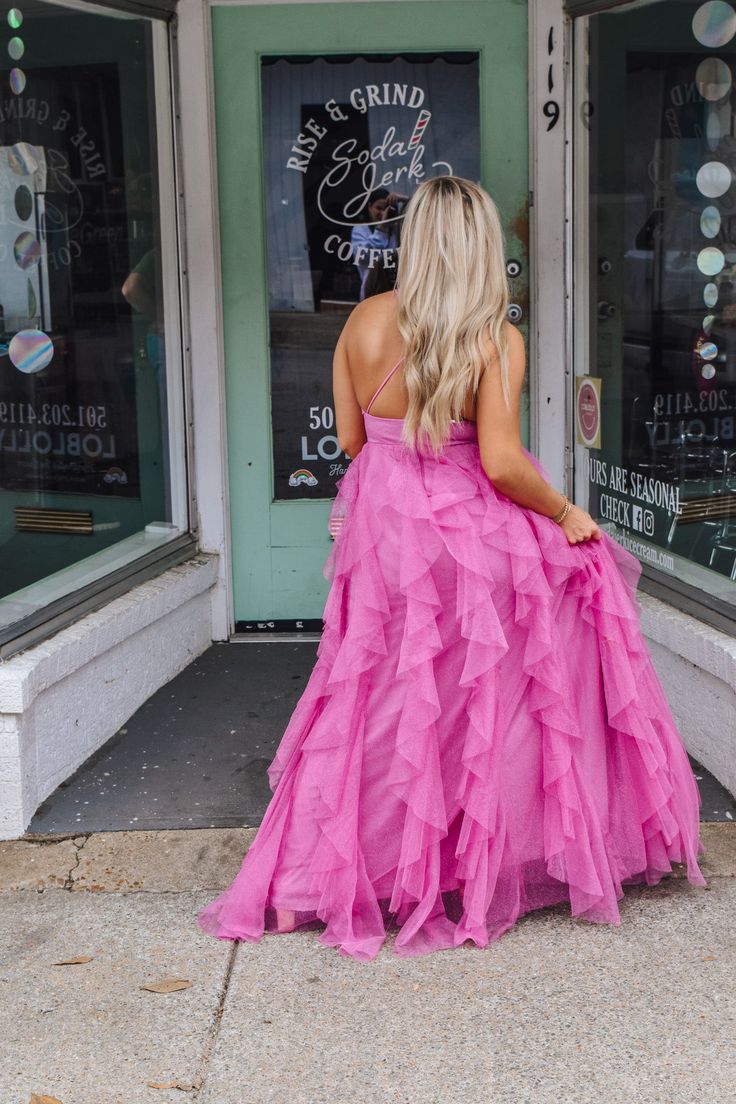 Get ready to dazzle in our Dangerously Perfect Pink Ruffle Dress! This elegant and formal dress features a sparkly fabric that will definitely make you stand out in any crowd. Perfect for a special occasion or a night out, this dress is dangerously perfect in pink! Pink Bridesmaid Gown For Prom Season, Pink Maxi Dress For Prom, Pink Maxi Dress For Prom Season, Party Gown With Tulle Ruffled Skirt, Chiffon Maxi Dress With Ruffles For Prom Season, Chiffon Ruffle Maxi Dress For Prom, Spring Princess Dress With Ruffled Skirt, Princess Style Summer Gown With Ruffles, Princess Style Evening Dress For Party Season