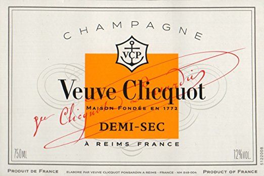 a label for a bottle of wine with the words veuve clicquiot on it