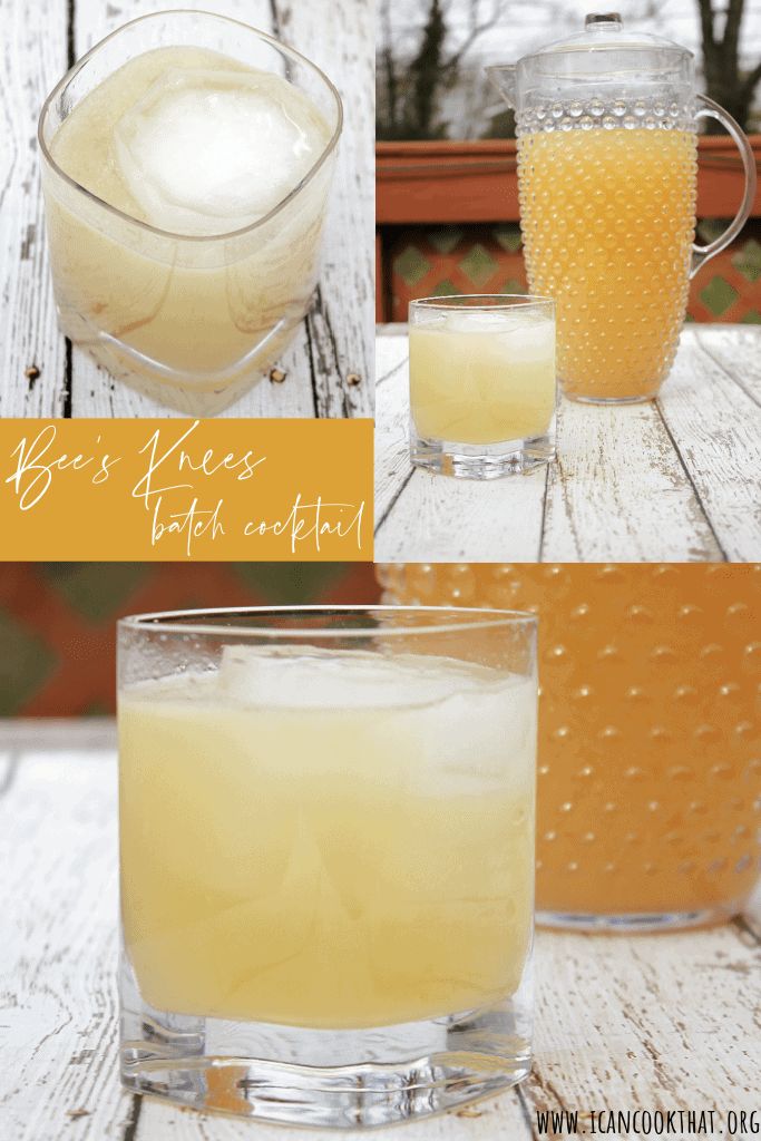 two glasses filled with liquid sitting on top of a wooden table next to a pitcher