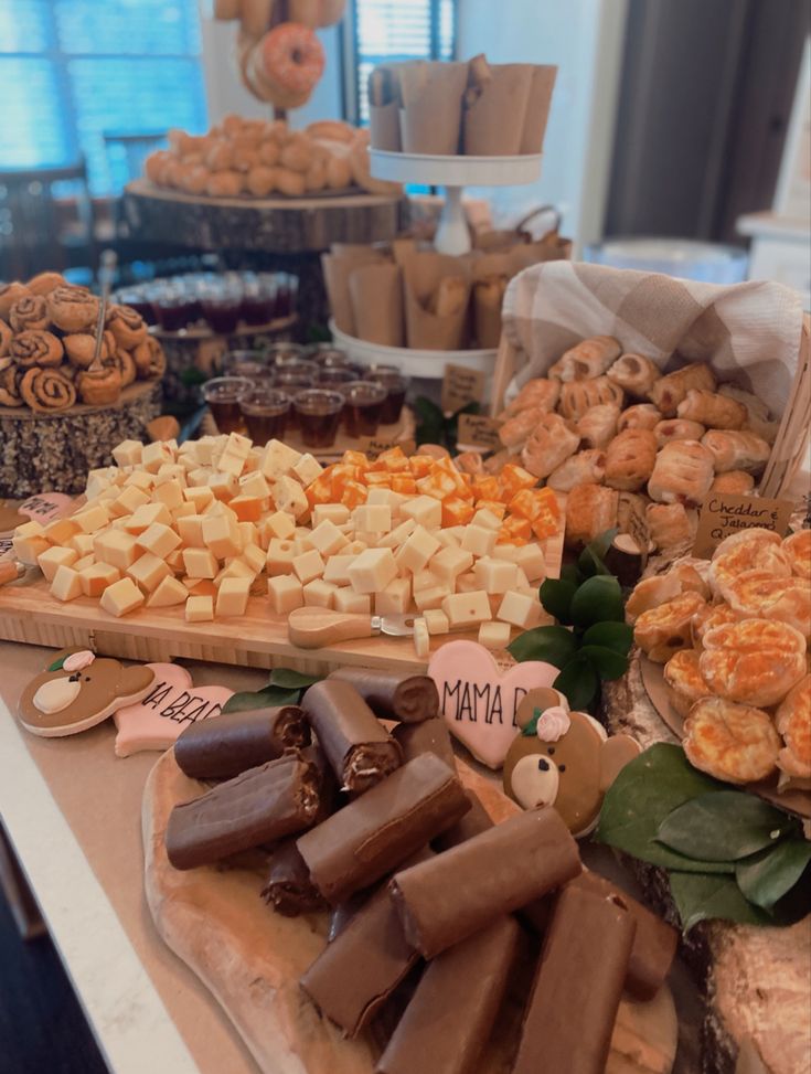 an assortment of desserts and pastries displayed on a table