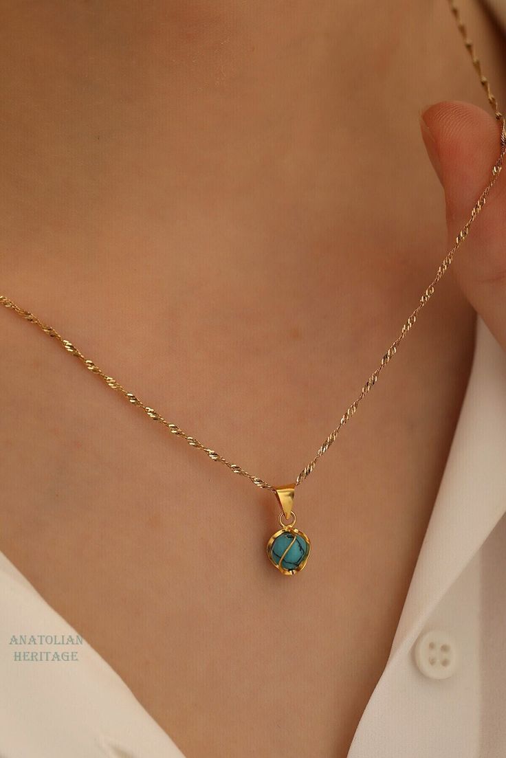 Handmade 14k Gold Necklace with Turquoise for Women, Gold necklace for Women, Dainty Gold Necklace for Women, Handmade Turquoise Necklace This beautiful dainty handmade 14K Gold necklace comes with a small round turquoise stone in a circle cage that gives both modern and minimalist look. This is a great gold necklace for everyday use, but also good for special occasions. Chain Length: 45 cm Weight of Necklace: Approximately 1.20 gr Length of Pendant: 15 mm Width of Pendant: 8 mm Since this is a 14k Gold Turquoise Necklace For Gift, Dainty Turquoise Gold-plated Jewelry, Turquoise Round Jewelry For May Birthstone, Blue Round Pendant Necklace For May Birthstone, Blue Round Pendant Jewelry For May Birthstone, Turquoise Birthstone Pendant Necklace, Blue May Birthstone Round Pendant Necklace, Blue Round Pendant For May Birthstone, Dainty Turquoise Round Pendant Jewelry