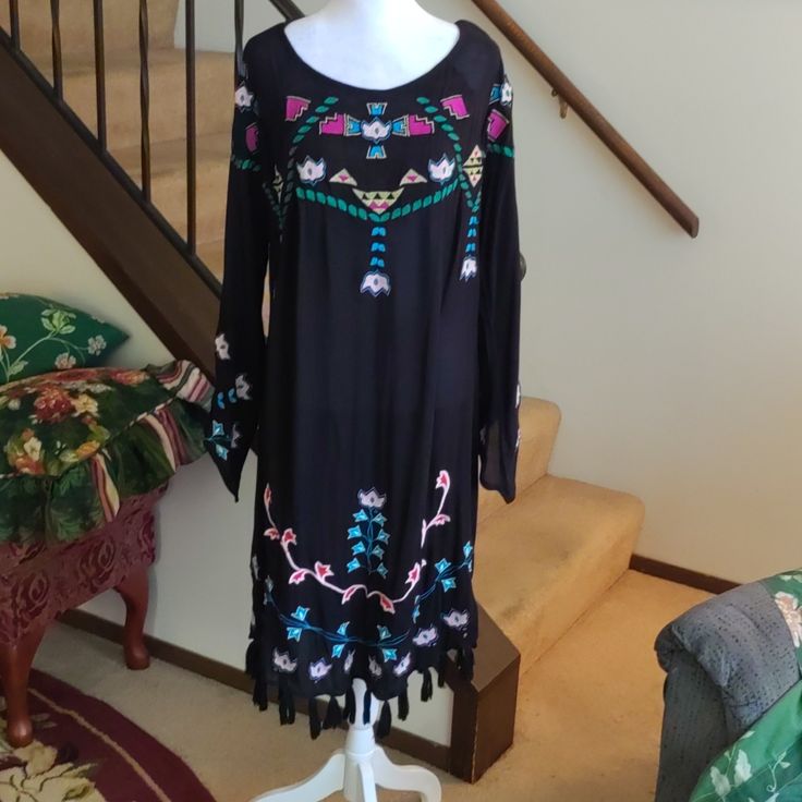 Sundance Dress. Lightweight Black Gauze Dress. Beautiful Multicolor Aztec Embroidery. Bell Sleeves. Tassel Hemline.Beautiful Summer Dress. 38" Long. Never Worn. Festival Tunic Dress, Black Fitted Embroidered Dress For Festival, Black Long Sleeve Dress For Festival, Black Tasseled Dresses For Festivals, Black Tassel Dress For Festivals, Black Tassel Dresses For Festivals, Black Long Sleeve Embroidered Beach Dress, Spring Fitted Dress With Beaded Fringe, Black Summer Dress With Beaded Fringe